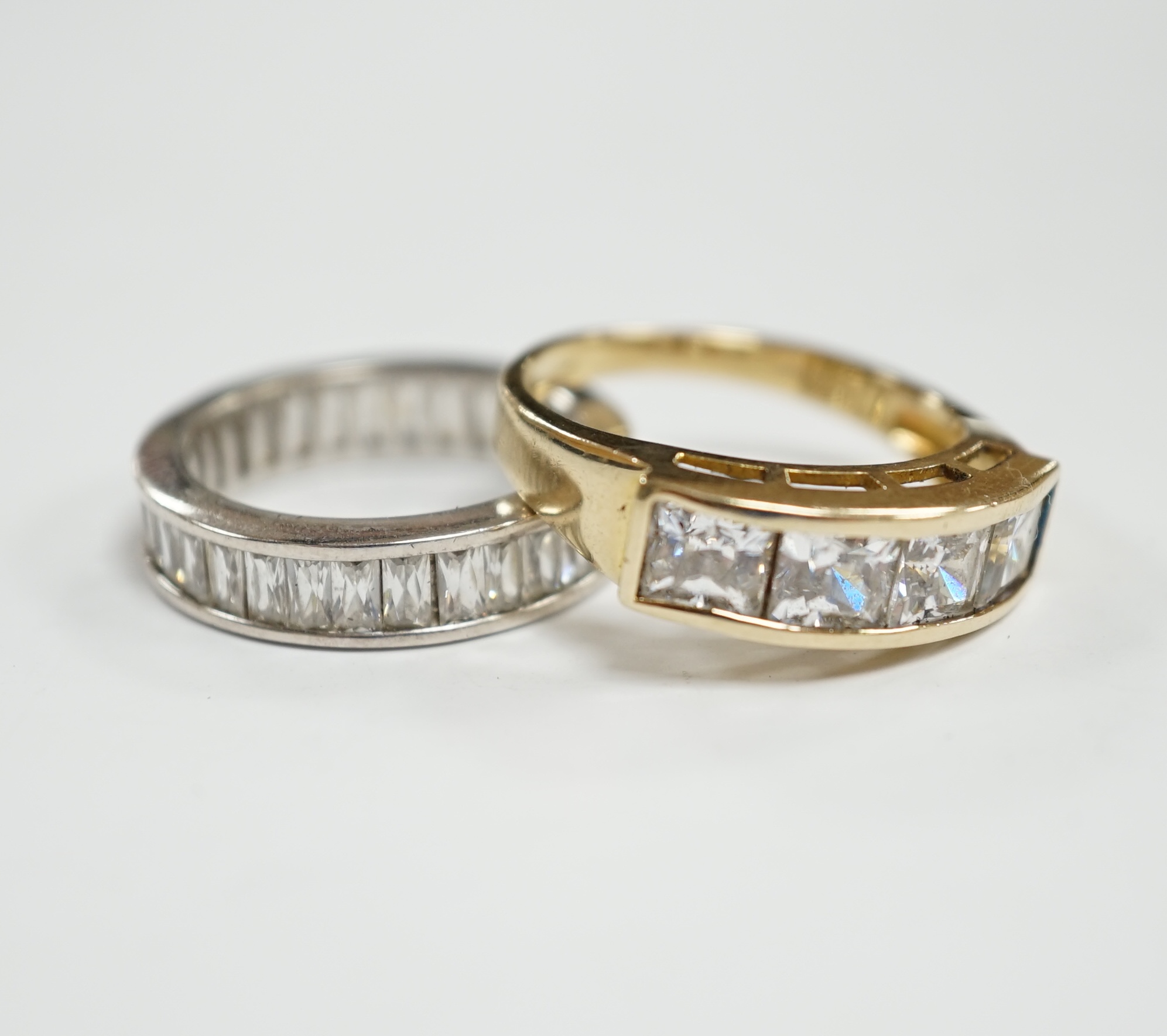 A 9k and simulated diamond set half hoop ring and a 925 and simulated diamond set eternity ring.